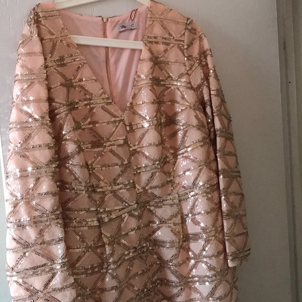 A Monif C Sequins Romper in a size 2X ..